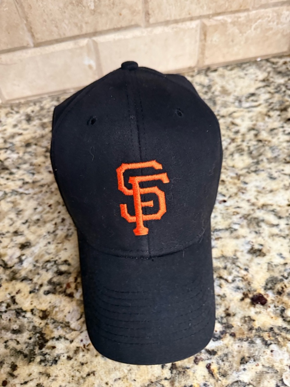 Genuine Merchandise Black Baseball Cap with Orange SF Logo